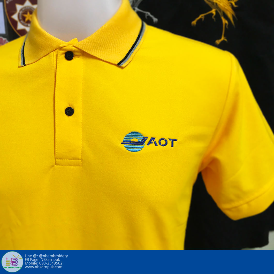 งานปักบนเสื้อโปโลสีเหลือง